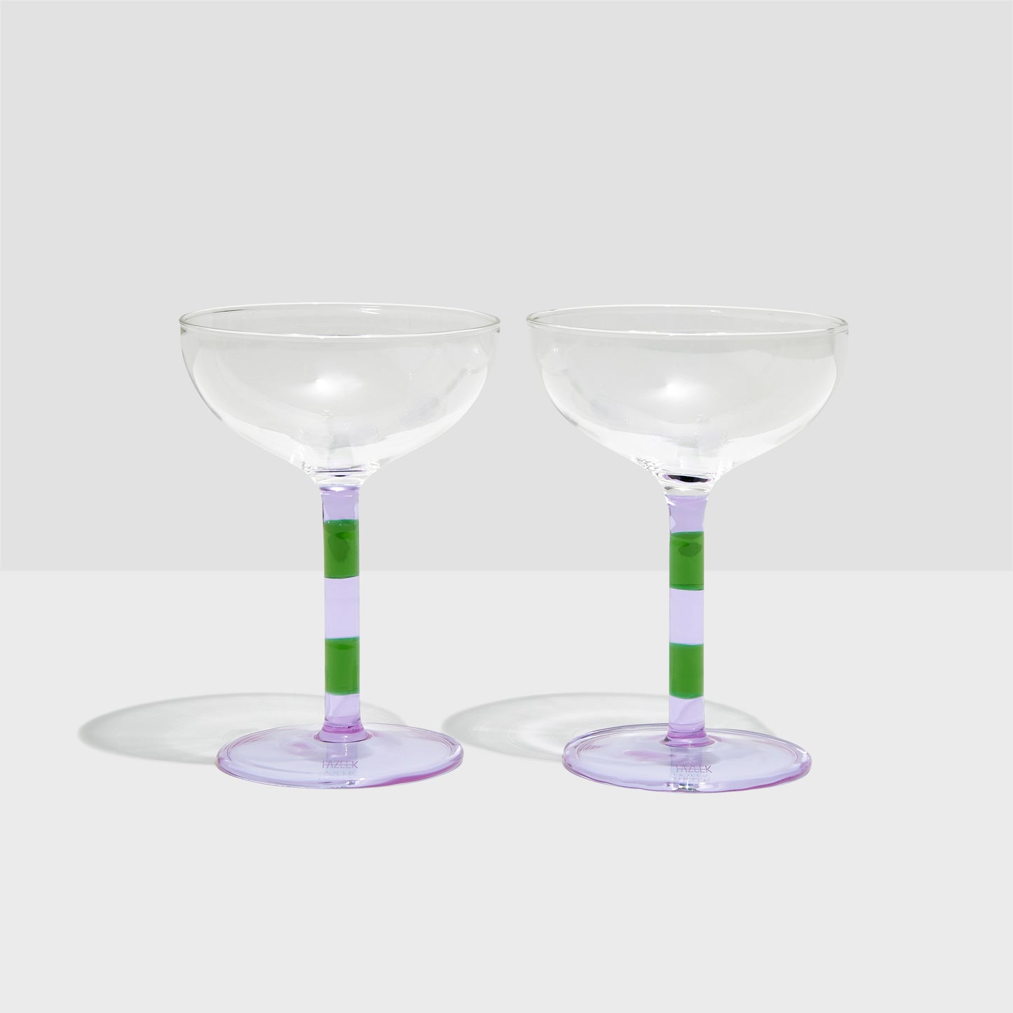 Shop Now STRIPED COUPE GLASSES - LILAC + GREEN - SET OF 2 at Fazeek